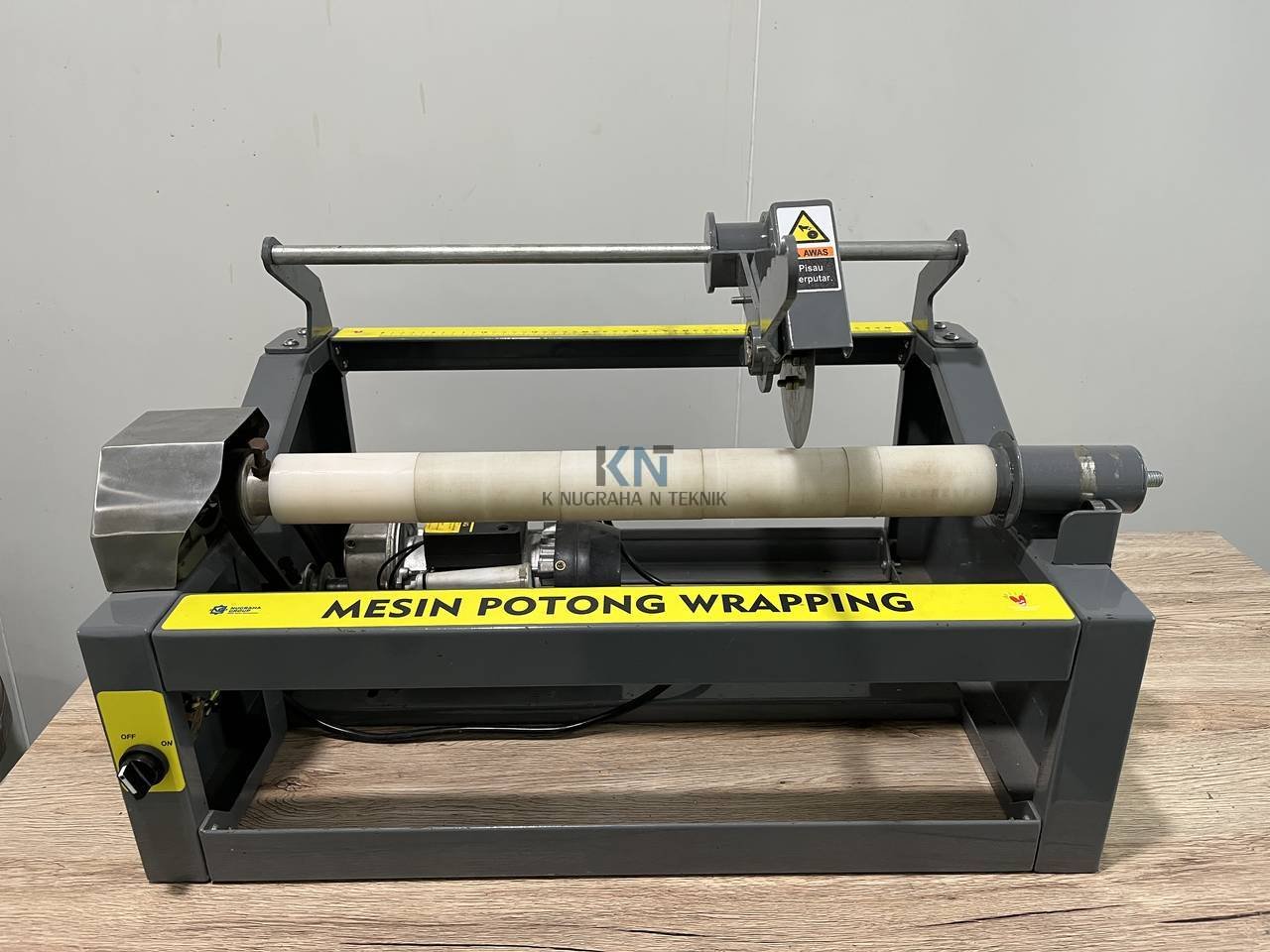 Mesin pemotong wrapping otomatis untuk industri pengemasan buatan K Nugraha N Teknik